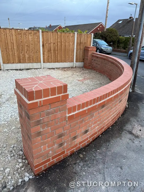 Curved garden wall with star pier caps