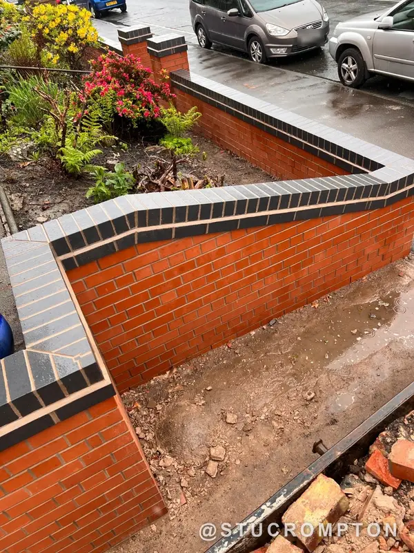Front wall with blue brick copings
