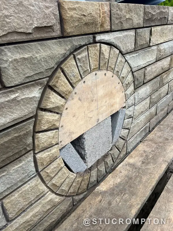 Stone wall with a round feature